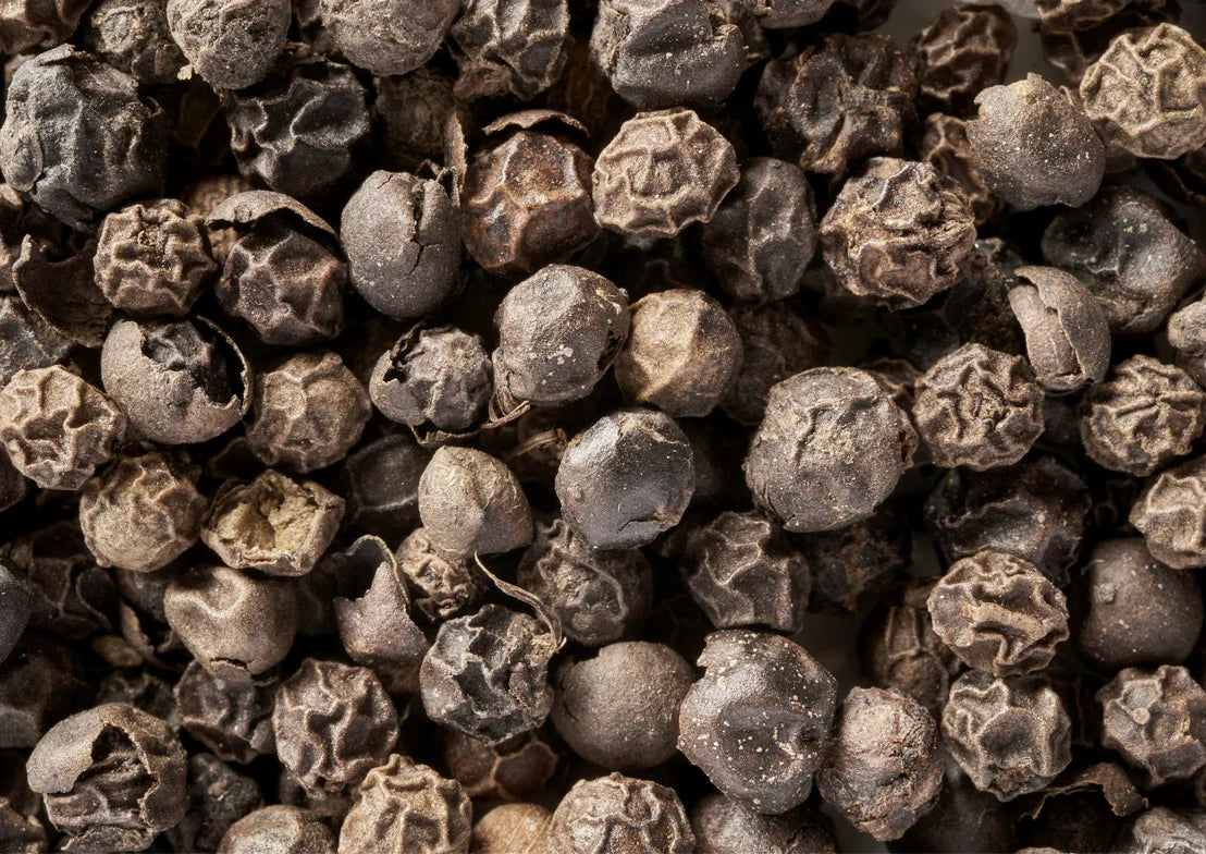 Whole black peppercorns